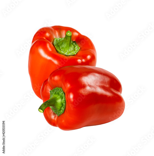Two red bell peppers isolated on a white background. © Svetlana Zibrova