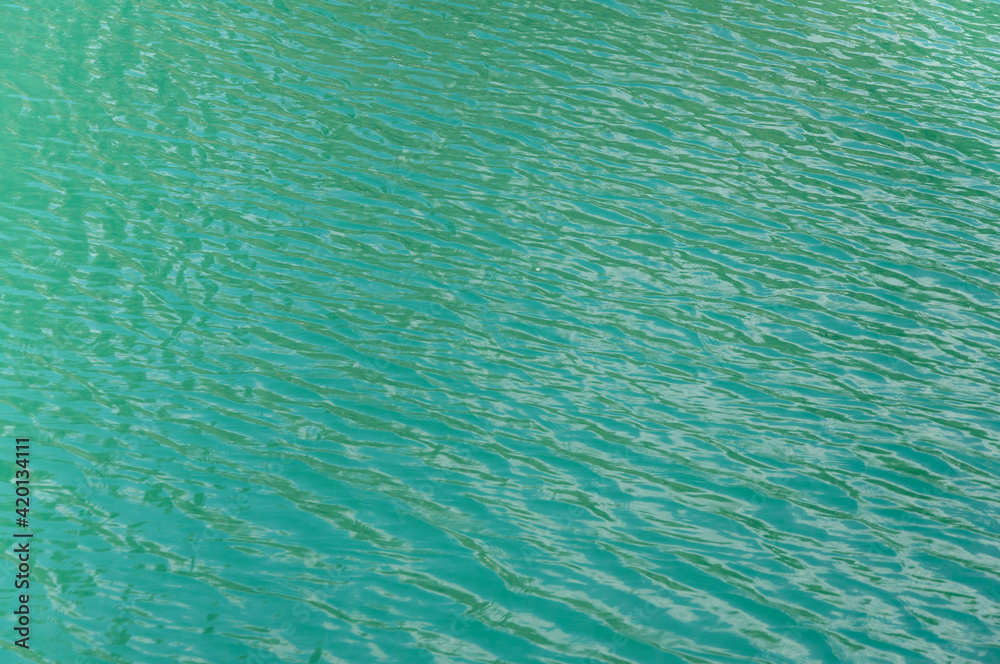 Blue sea water textured background. Ocean ripples. Grained photo Blue sea water textured background. Ocean ripples. Grained photo