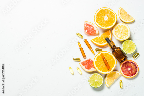 Vitamin C. Cosmetic products and fresh citrus fruits.