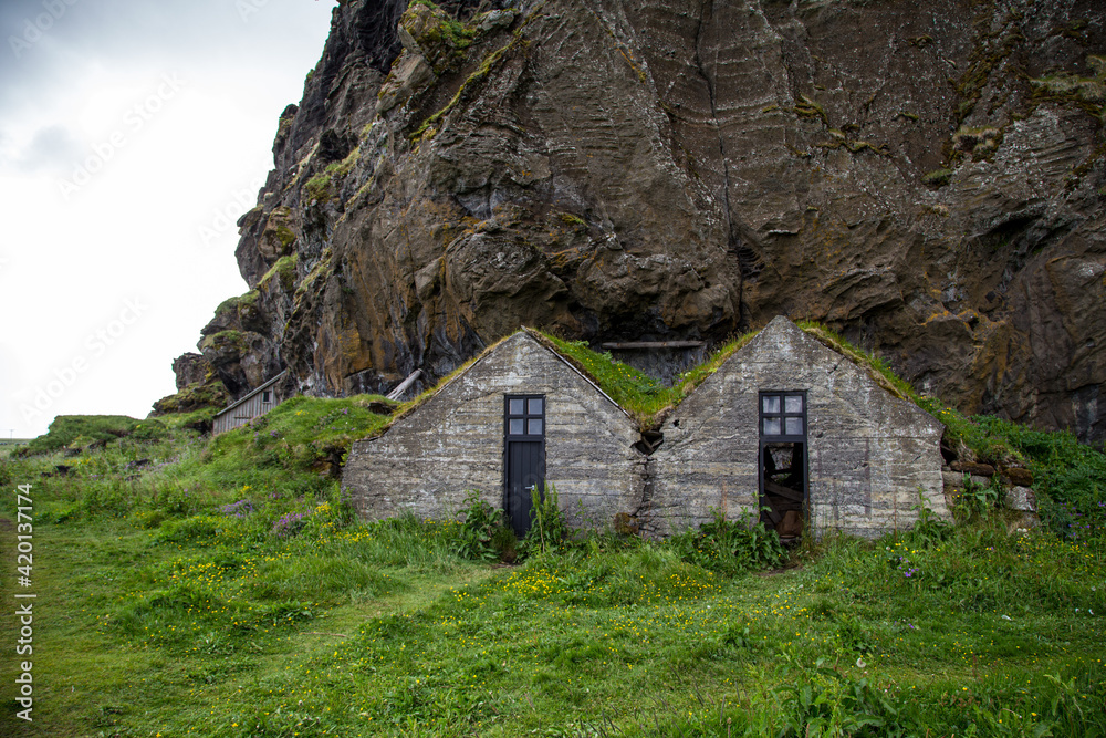 Drangurinn Rock, a mysterious giant boulder, sits below the Eyjafjöll Mountains