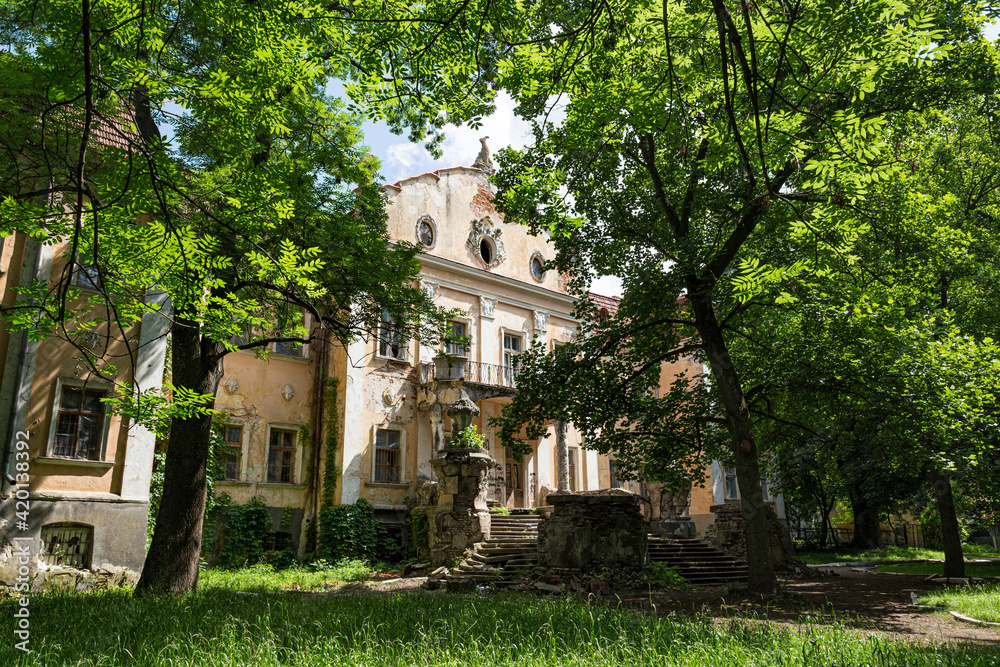 Old  palace of Archbishops in green park. Obroshino village near Lviv city. Ukraine.