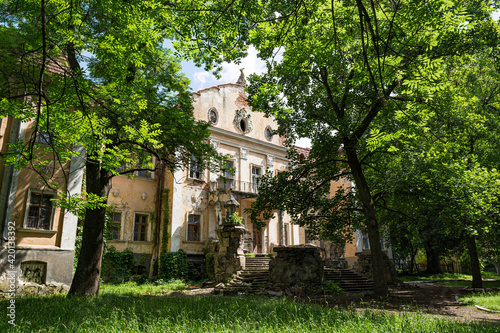 Old palace of Archbishops in green park. Obroshino village near Lviv city. Ukraine.