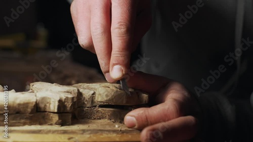 Close up of joiner working with wood frame slow motion
