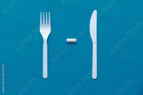 tablets  plastic knife and fork