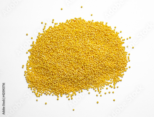 Raw millet groats on a white background