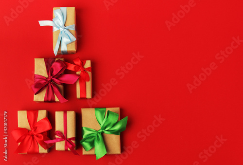Gifts packed with craft paper and colorful satin ribbons 