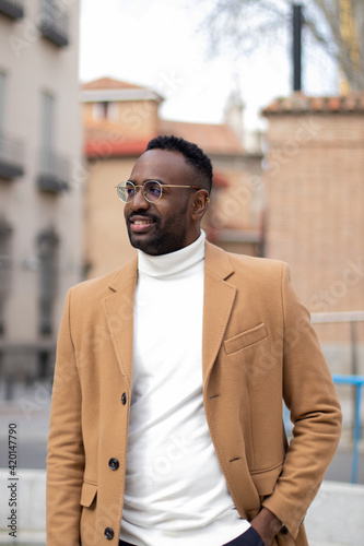 Elegant black man looking aside and posing.