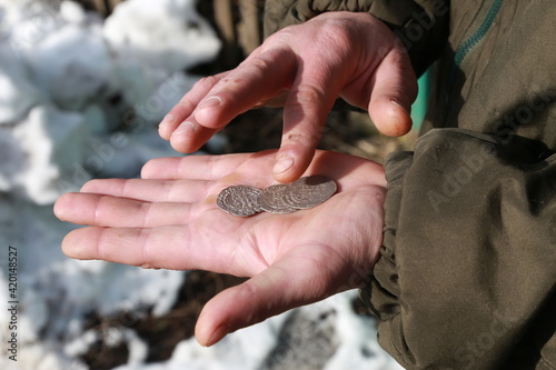 Old arabian silver coins on palm