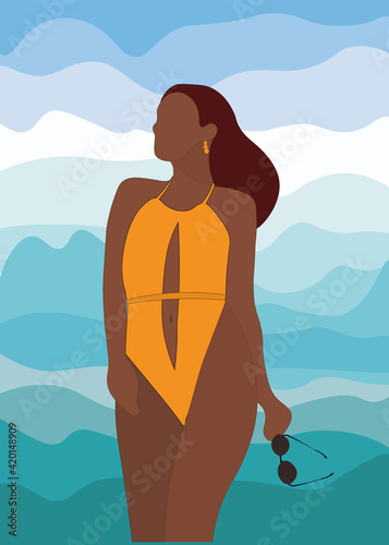 The tanned body of a girl in a swimsuit on the background.