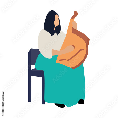 The girl plays the bandura. Ukrainian national instrument.