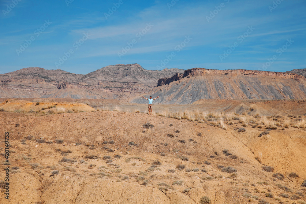 Man in American desert. Traveling in hot steppe.  Tourism and adventure concept