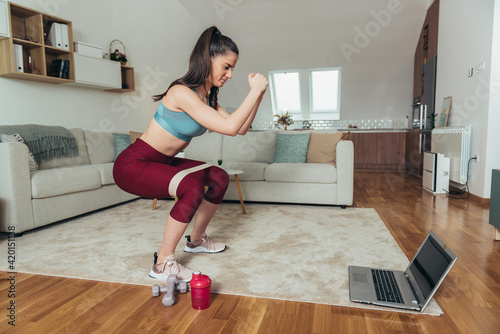 Attractive woman training at home