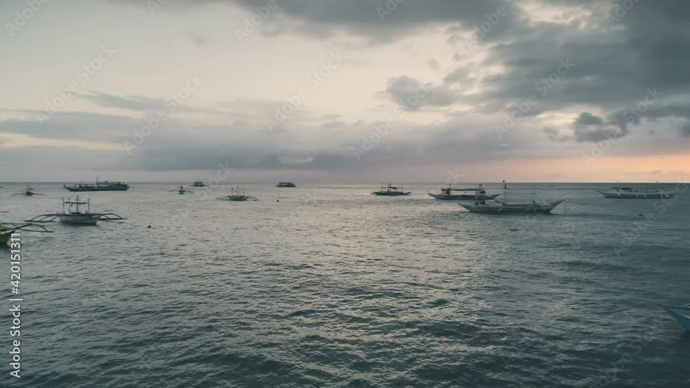 Sunset above sea bay with sail boats aerial. Nobody nature seascape. Reflected sun on water Sunset above sea bay with sail boats aerial. Nobody nature seascape. Reflected sun on water