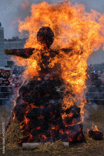 Burning effigy made from straw on traditional slavic national holiday Shrovetide