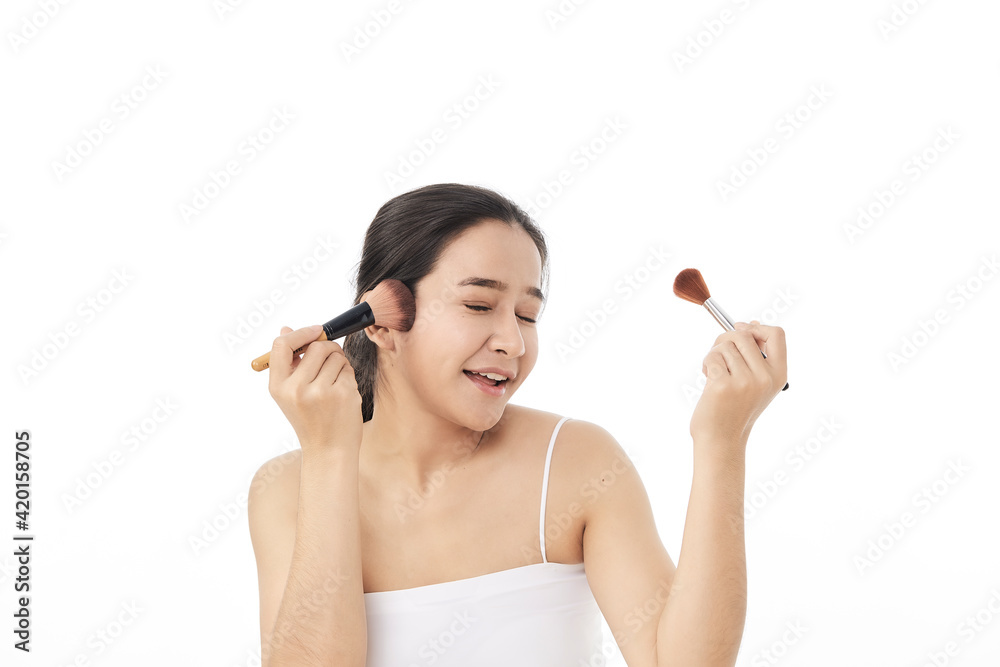 woman applying make up with a brush woman applying make up with a brush