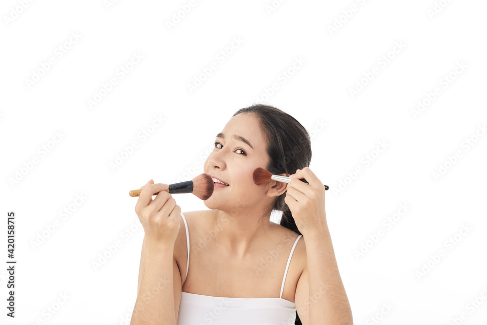 woman applying make up with a brush woman applying make up with a brush