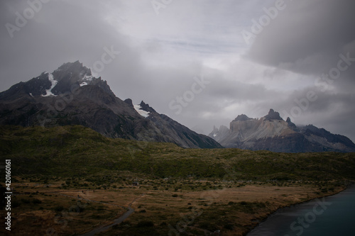 Beautiful mountains, a land, and a lake, in a dramatic landscape