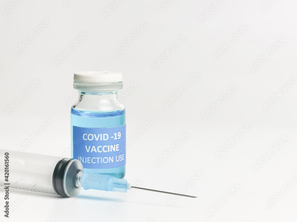 Selective focus close image of COVID 19 VACCINE with syringe isolated on white background. Selective focus close image of COVID 19 VACCINE with syringe isolated on white background.