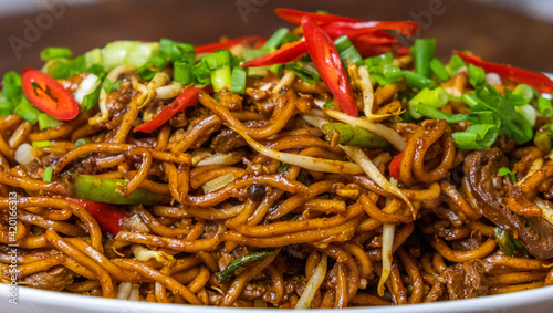 Malaysian popular dish stir fried noodles or locally known as Mee Goreng. Selective focus.