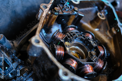 Damaged damaged motorcycle magnet coil or CDI unit.
