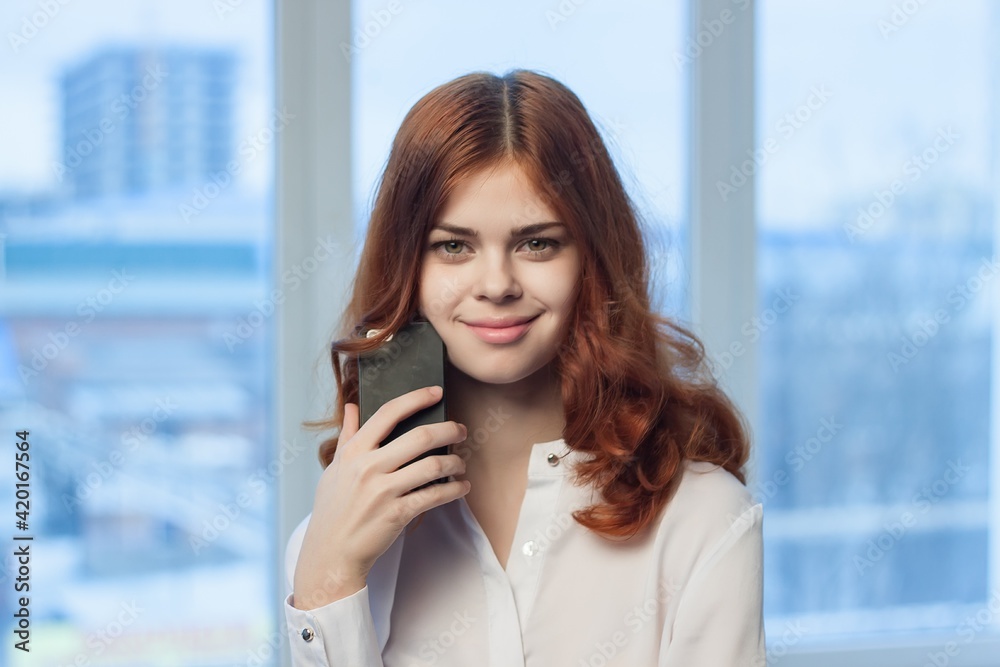 cheerful woman manager phone in hands communication professional technology