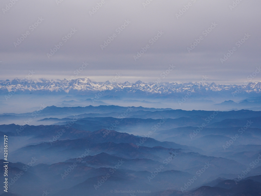 This was shot during the kedarkantha trek where you could see layers and layers of peak through the mountains 