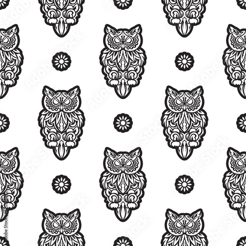 Fototapeta Naklejka Na Ścianę i Meble -  Black-white Seamless pattern of owls in boho style. Good for garments, textiles, backgrounds and prints. Vector