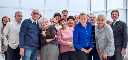 group of happy seniors look at camera