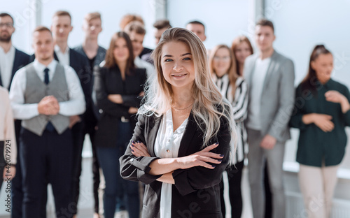 ambitious young business woman standing in front of her colleagues