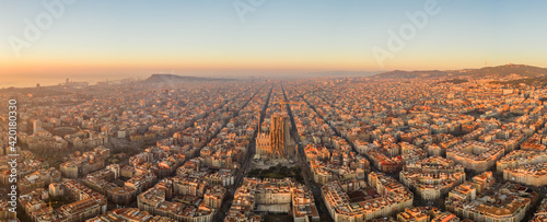 Photography Aerial panorama drone shot of sunrise over sea horizon of Barcelona city in Spai