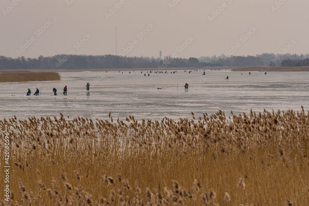 frozen river, bent and icy anglers