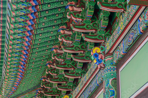 Colorful eves of Buddhist temple building.