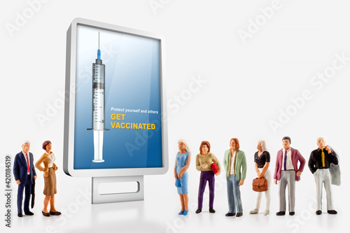 a group of different age people are standing in front of a billboard with a message to get vaccinated against covid-19