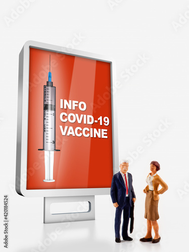 a group of different age people are standing in front of a billboard with information about the covid-19