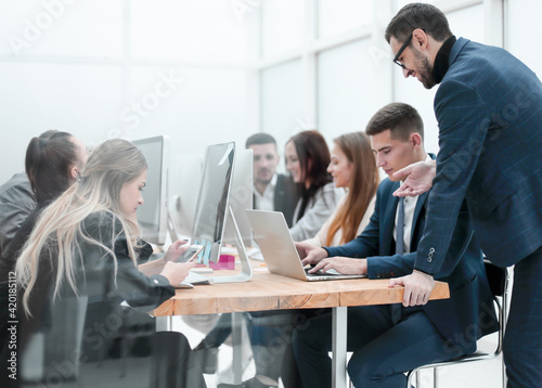 group of employees work in a modern office