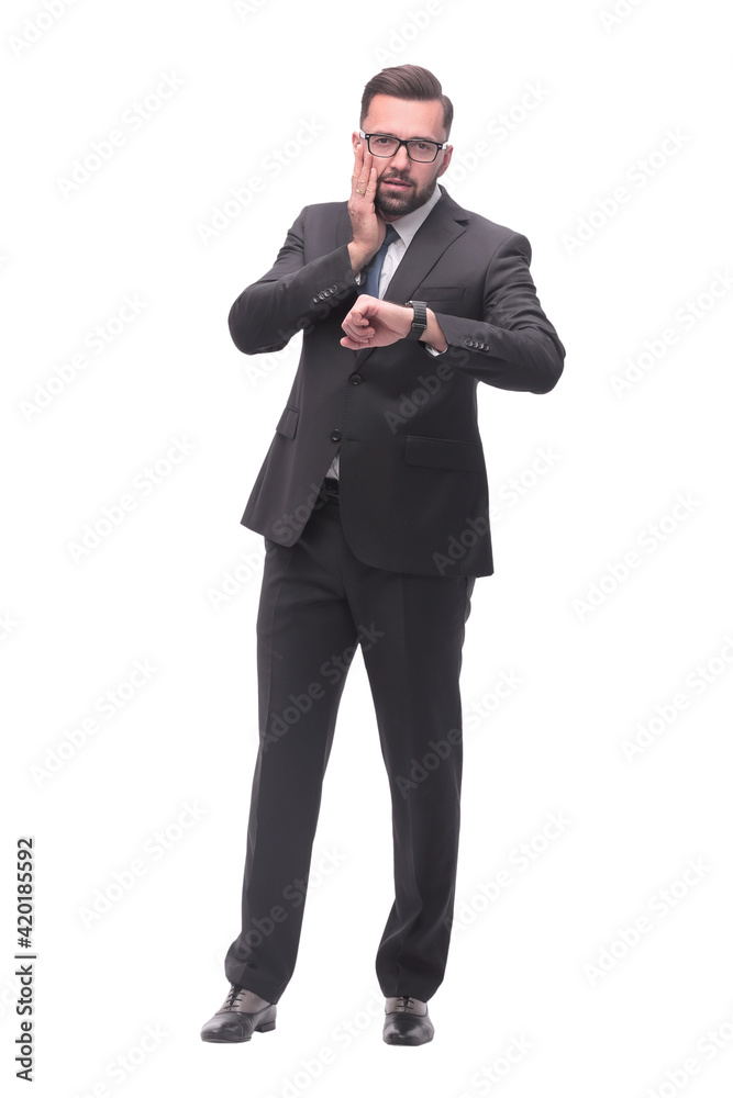 Fototapeta premium full length . Executive businessman looking at his wristwatch