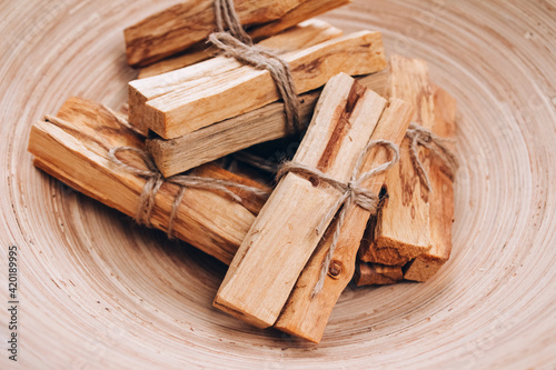 Canvas Print Palo Santo tree sticks in wooden bowl - holy incense tree from Latin America