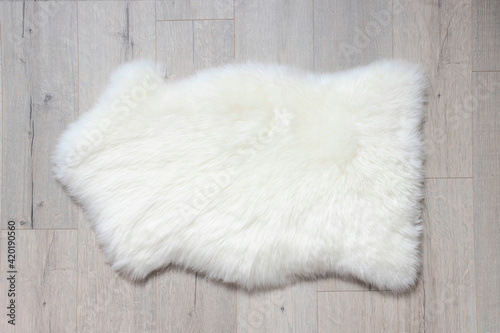 here's a sheep skin on the floor. Top view, copy space