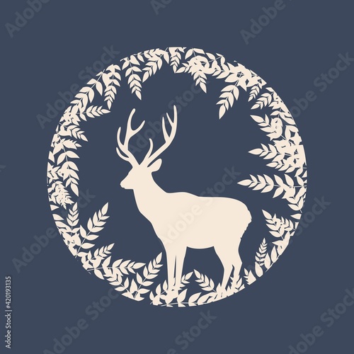 Silhouette of a deer in a circle with plants