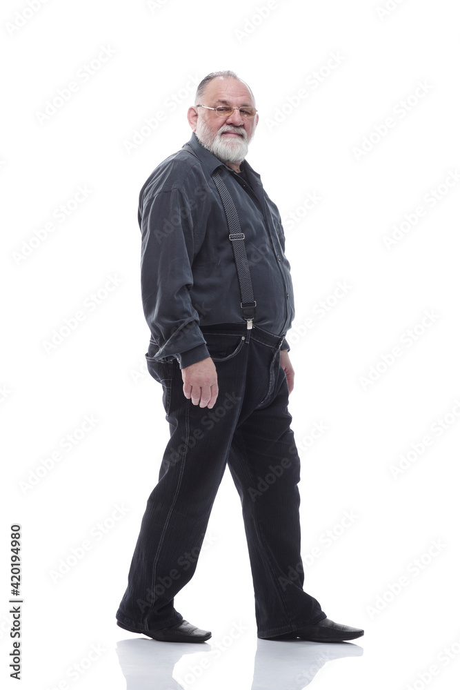in full growth. happy bearded man striding forward. in full growth. happy bearded man striding forward.