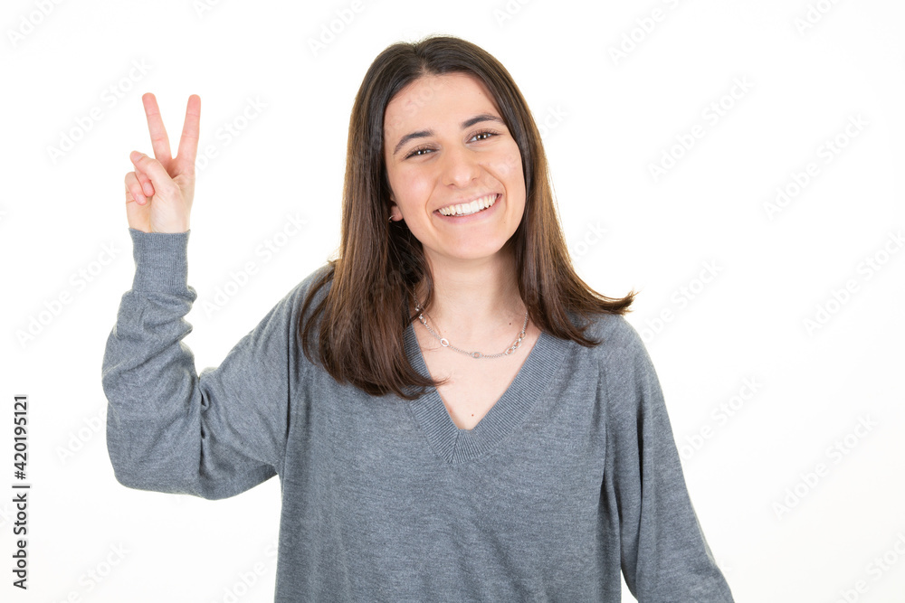 pretty woman showing v two fingers positive and peace gesture hand on white background pretty woman showing v two fingers positive and peace gesture hand on white background
