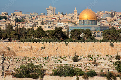 City of Jerusalem with the gold-topped Dome of the Rock and wall of Jerusalem, Israel.