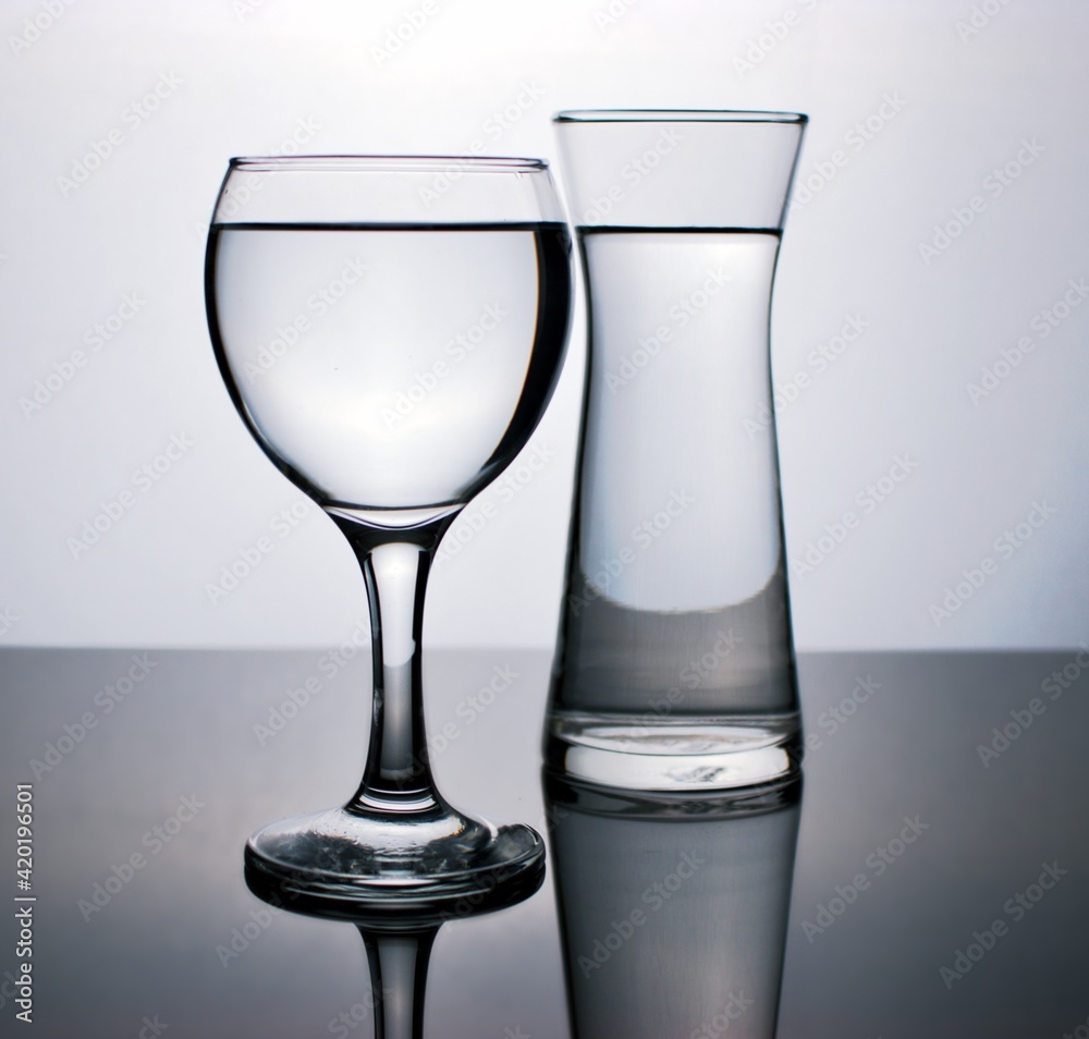 Glass of water isolated in black and white image for background ,glass of wine ,dinner ware ,glass with water Glass of water isolated in black and white image for background ,glass of wine ,dinner ware ,glass with water
