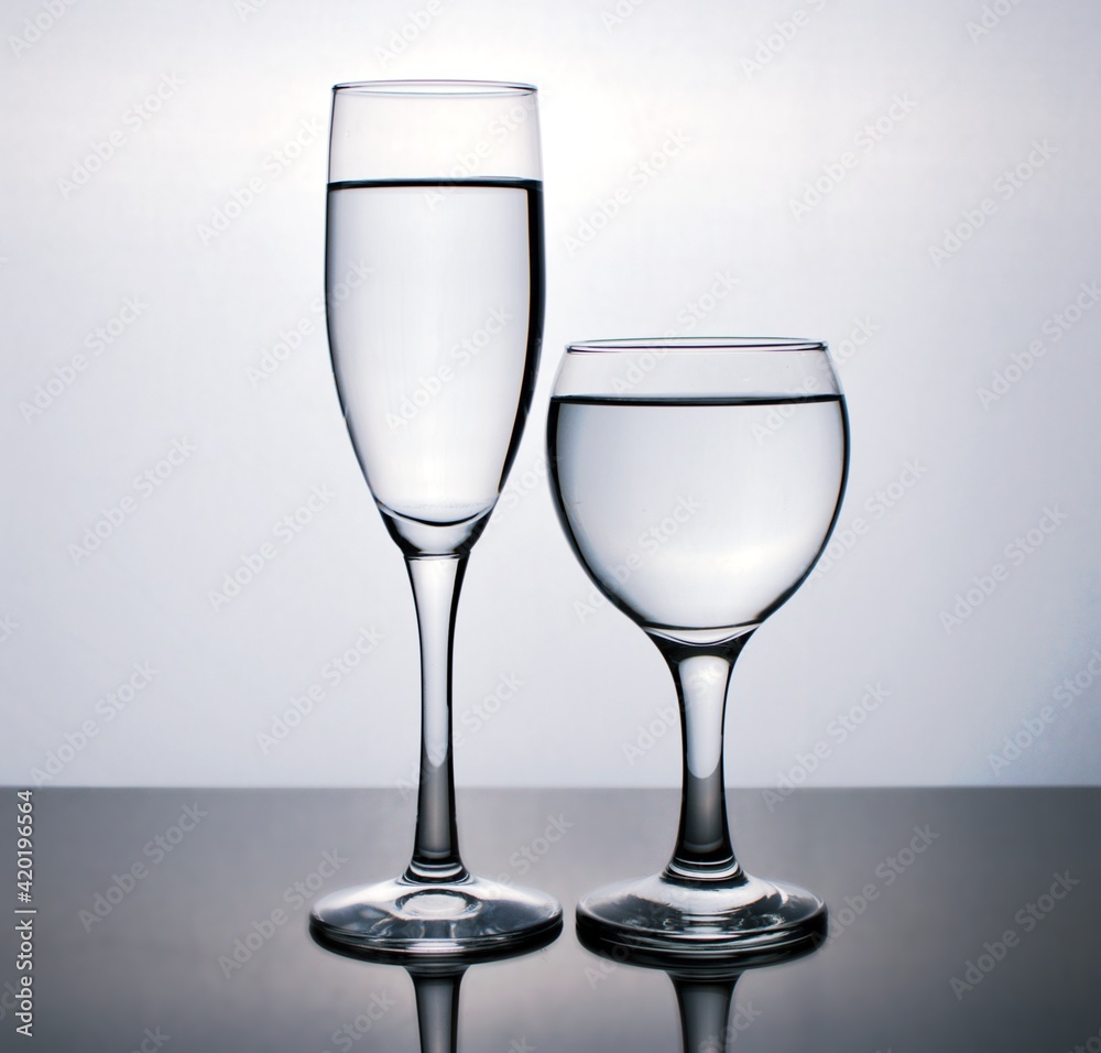 Glass of water isolated in black and white image for background ,glass of wine ,dinner ware Glass of water isolated in black and white image for background ,glass of wine ,dinner ware