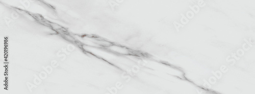White carrara marble texture background with curly grey colored veins, it can be used for interior-exterior home decoration and ceramic decorative tile surface, wallpaper, architectural slab. © Tomas Paas