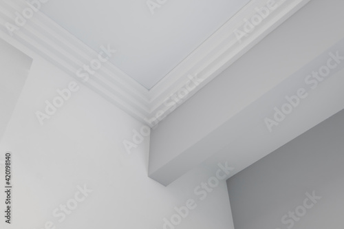 Detail of corner ceiling cornice with intricate crown moulding.