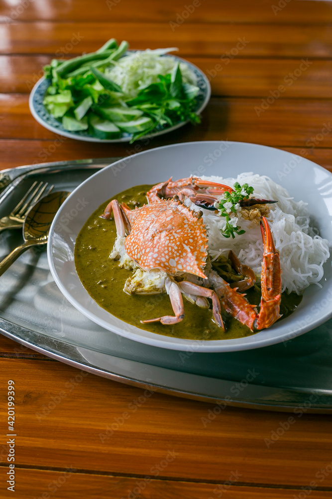 Food Concept: Southern Thai dish of Crabmeat Curry traditionally served with fermented rice noodle
Food Concept: Southern Thai dish of Crabmeat Curry traditionally served with fermented rice noodle