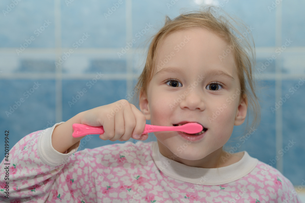 shaggy girl in pajamas brushing his teeth