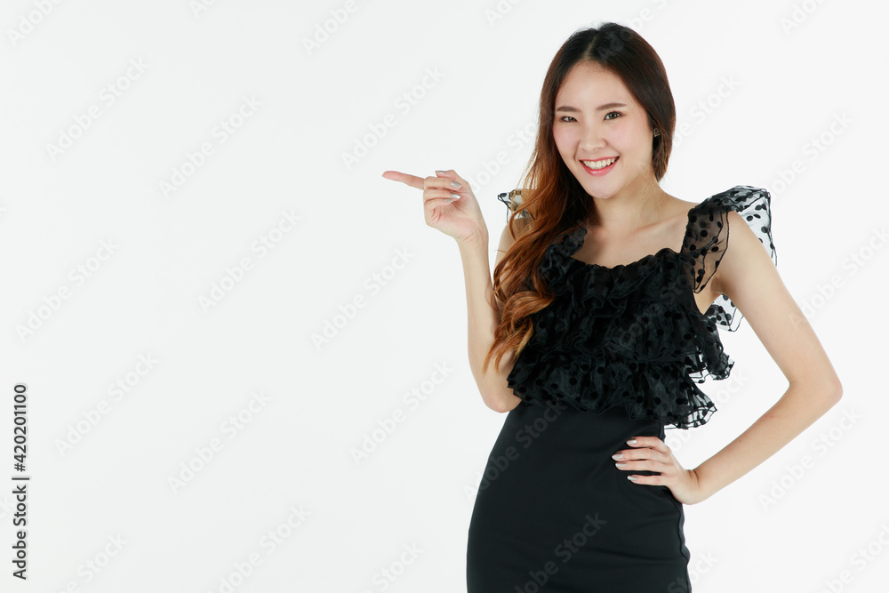 Portrait of young and cute self-confidence brunette long hair Asian girl with smile and friendly face. Charming girl pose with happy studio shot isolated on white background with finger pointing Portrait of young and cute self-confidence brunette long hair Asian girl with smile and friendly face. Charming girl pose with happy studio shot isolated on white background with finger pointing