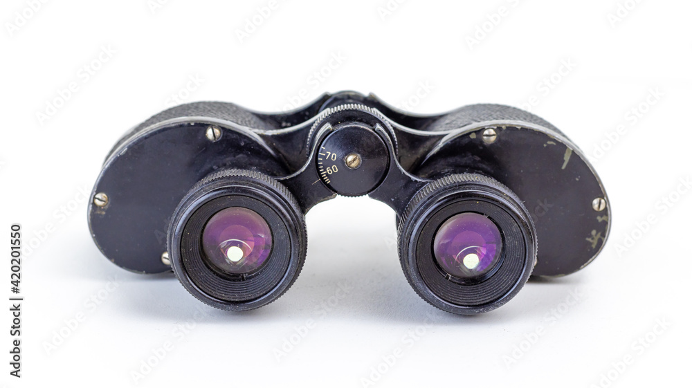 Old military binoculars close-up. Soft focus. Old military binoculars close-up. Soft focus.